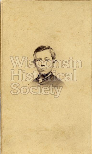 Head and shoulders studio portrait of a young man. Back stamped: Fuller, Gilman's Block, Madison, Wis.