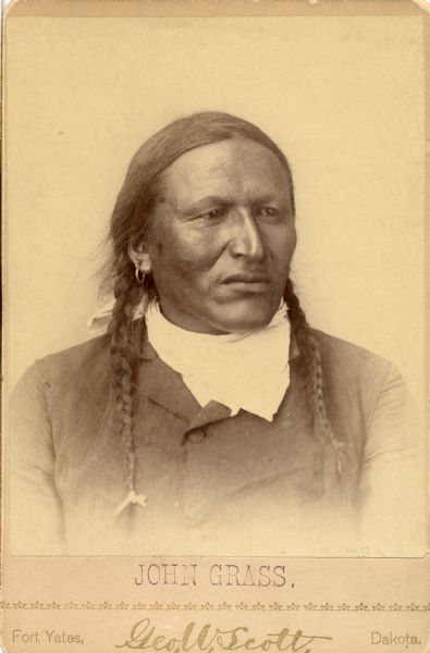Quarter-length studio portrait of Chief Charging Bear (also known as John Grass).