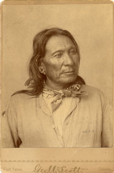 Studio portrait of Two Bear, member of the Sioux tribe.