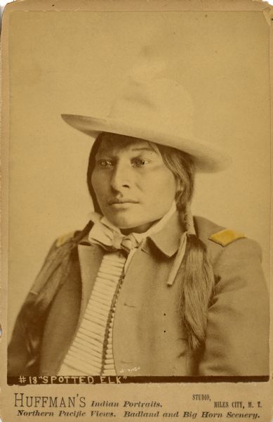 Studio portrait of Spotted Elk, possibly a member of the Sioux Nation.