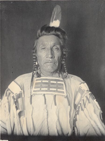 Studio portrait of Sub-Chief Arupa Esash (Big Shoulder Blade). Part of the Siouan (Sioux) and Crow Tribes.