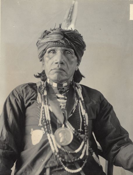 Studio portrait of Iowa man, Emi-dughra, known as John Ford. Part of Siouan (Sioux) and Iowa Tribes