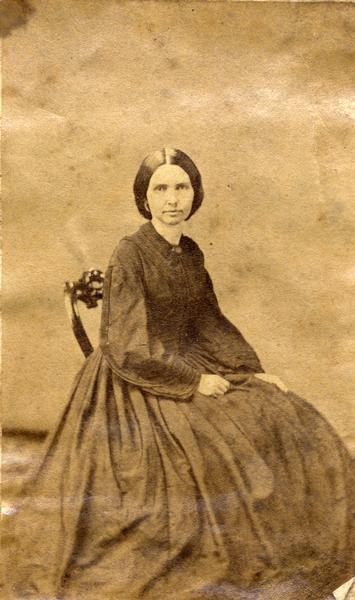 Studio portrait of Mrs. Simpson, seated, probably a relative of Ulysses S. Grant. This image is one of several from the Grant family bible.