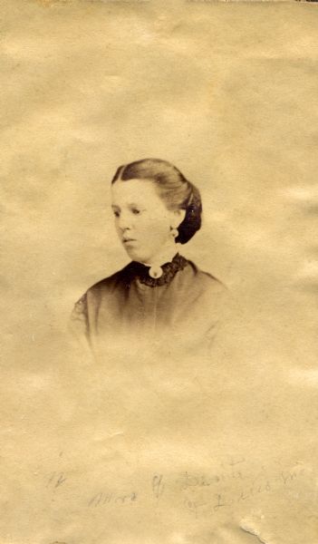Vignetted head and shoulders portrait of Mrs. G. Dent, wife of G. Dent and sister-in-law of Julia Dent Grant. This image is one of several on a page from the Grant family album.