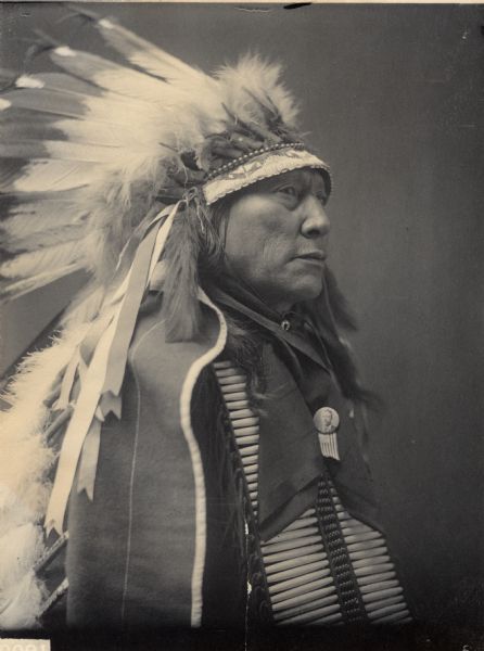 Portrait (Profile) of Chief Mato-He-Hlogeco or Matho-Hexaloketca or Hu-Hu-Lo (Hollow Horn Bear or Bones) or Hoo-Hoo (The Bone), Son of Maza-Pankisko (Iron Shell), in native dress with headdress and breastplate, wearing a campaign button, possibly of Theodore Roosevelt. Part of Siouan (Sioux) and Brule Tribes.
