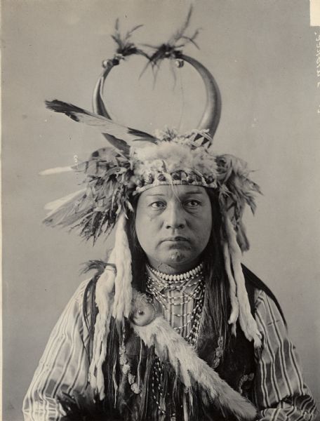 Studio portrait of Chief Paul Showeway with horned headdress and ornaments. Part of Waulatpuan and Cayuse Tribes