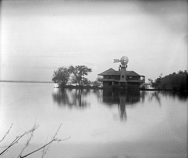 Rocky Roost, west of Governor's Island in Lake Mendota.  The structure was designed by Frank Lloyd Wright for his childhood friend Robert Lamp. The home's windmill is in front of the dwelling.