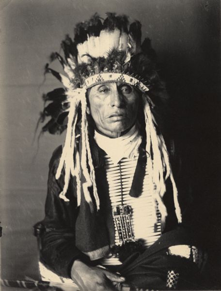 Studio portrait of Yankton Dakota man, Canhdeska Tawa (His Hoop). Part of Siouan (Sioux) and Yankton Tribes.