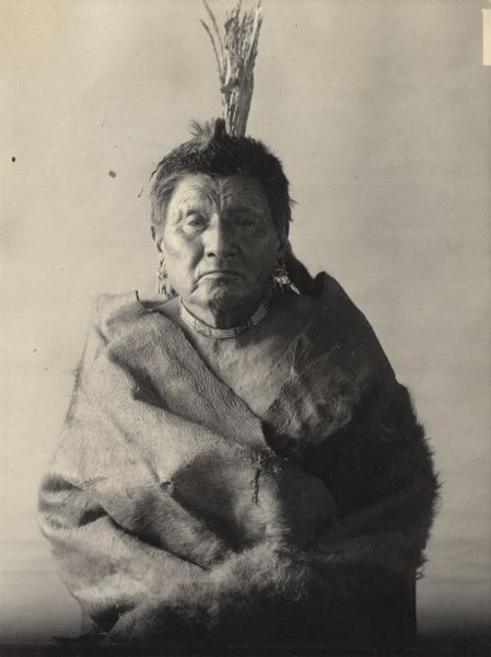 Studio portrait of Tah-He-Rus-Sah-We-Cha (Sitting Bull), priest, Pawnee. Part of Caddoan and Pawnee Tribes.  