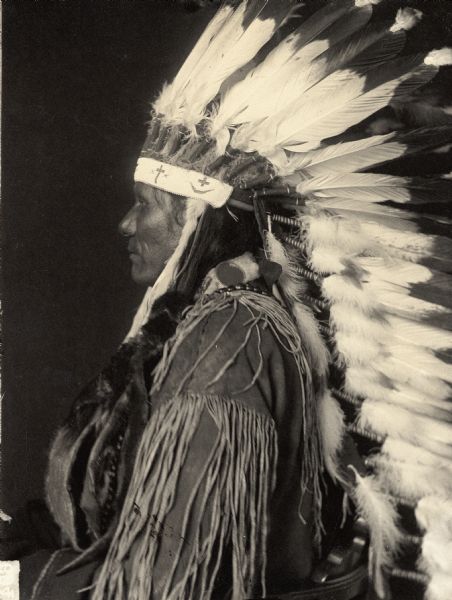 Profile studio portrait of Ponca man, Wa-non'-she-zhin-ga or Little Soldier. Part of Siouan (Sioux) and Ponka Tribes.