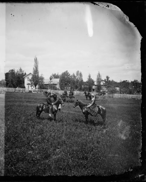 H.A. Prensor and J.A. Ottesen and their families leaving the home of R. Daniel Rickelsen in Lodi.