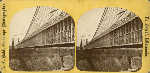 An A.L. Dahl photograph, one of "Two different side views of the Suspension Bridge," from the series "Niagara Falls and Suspension Bridge" as mentioned in his 1877 "Catalogue of Stereoscopic Views."
