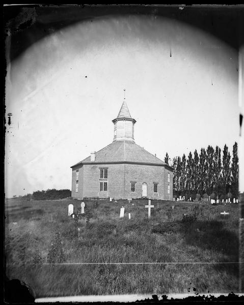 West Koshkonong Lutheran Church and cemetery. Octagonal stone church built in 1852, rebuilt in 1893, seating 800 people.