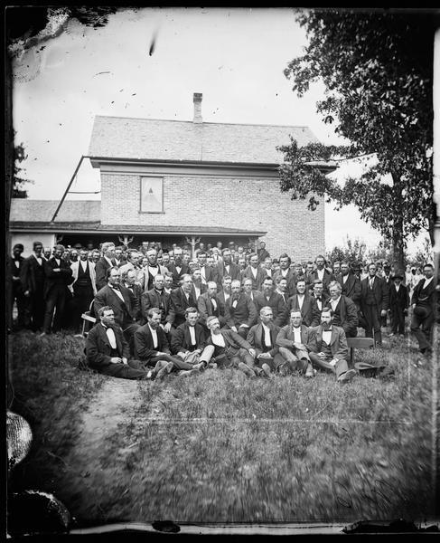 Group portrait of the ministers who attended the Eastern District Norwegian Synod, May 31-June 6, 1877, at the Immanuel Norwegian Evangelical Lutheran Church.  astor E.J. Homme, host minister, seated left, second row.