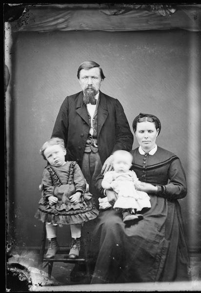 Studio portrait of a couple with two children.