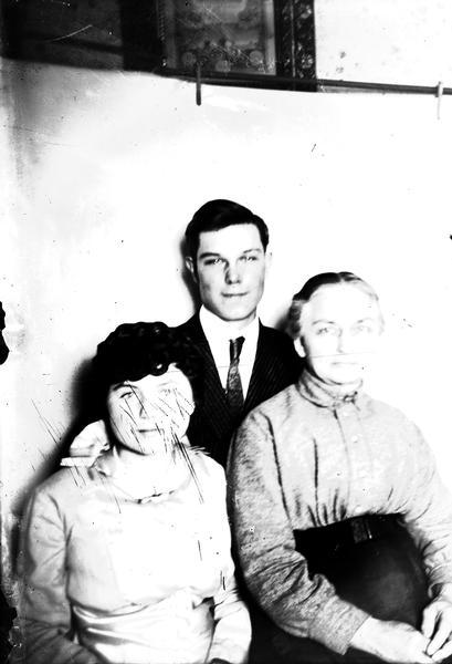 L. Mock and her mother and brother. Lewis Dahl's cousins.