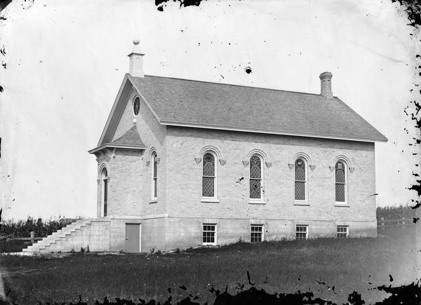 Albion Prairie Methodist Church, built in 1871 or 1872. It is surrounded by cornfields.