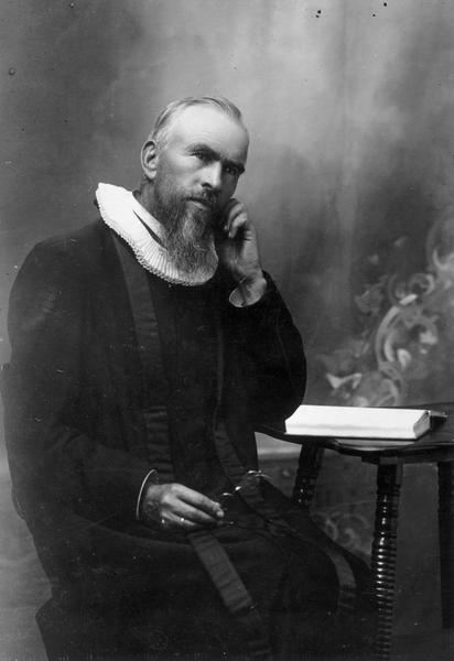 Portrait of Andrew Dahl. Dahl was a minister in the Norwegian Evangelical Lutheran Church, from around 1910. Dahl was born in Valdres, Norway, in 1844, immigrated to the United States in 1869 and worked as a photographer from 1869 to 1879. He became a Lutheran minister in 1883 and served his church in Wisconsin, North Dakota and Minnesota. He died in 1923.