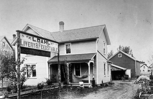View of the second Dahl establishment, with Walter Dahl and his dog out in front.