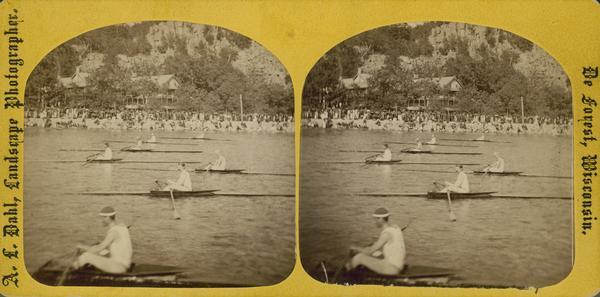 "The Grand Regatta, at Devil's Lake, Sauk County, June 21st & 22nd, 1877", with spectators watching rowing shells race.