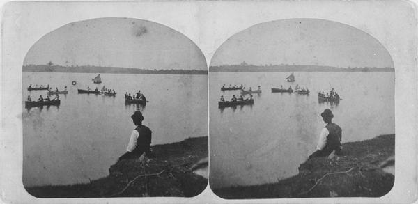 A stereograph of rowing, sailing and fishing on Lake Monona in Madison. The back of this yellow carded stereograph reads "The Beauties of Madison and Surroundings. Andrew L. Dahl, Landscape Photographer, DeForest, Wisconsin."