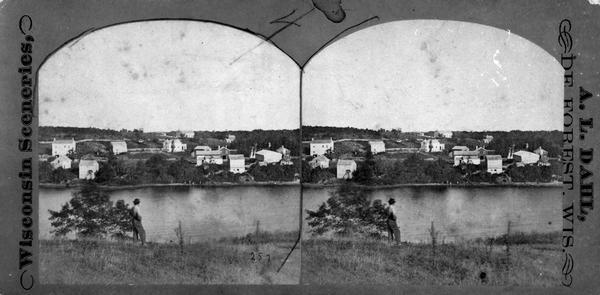 A distant view of Clinton, now Rockdale, in Christiana Township looking across the millpond on Koshkonong Creek towards the town.