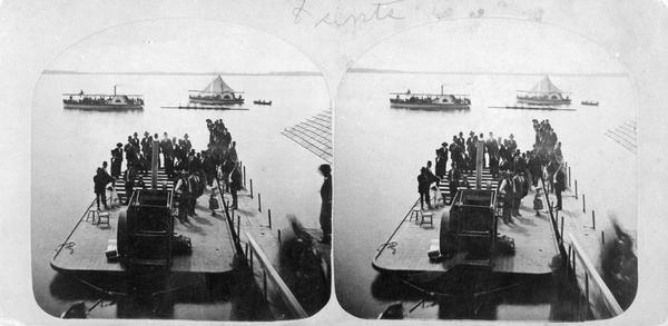 Stereograph of a lake scene in Madison, probably looking south on Lake Monona at a boat race in progress. From the series "The Beauties of the City of Madison and Vicinity."