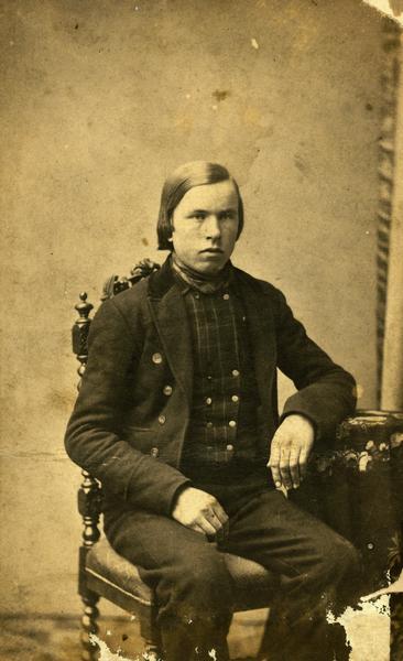 Studio portrait of the young Andreas Larsen Dahl taken in Christiania (now Oslo), Norway, before he immigrated to the United States in 1869. Dahl was born in Valdres, Norway, in 1844 and worked as a photographer in Wisconsin from 1869 to 1879. He was sometimes known as Andrew Dahl. He became a Lutheran minister in 1883 and served his church in Wisconsin, North Dakota and Minnesota. He died in 1923.