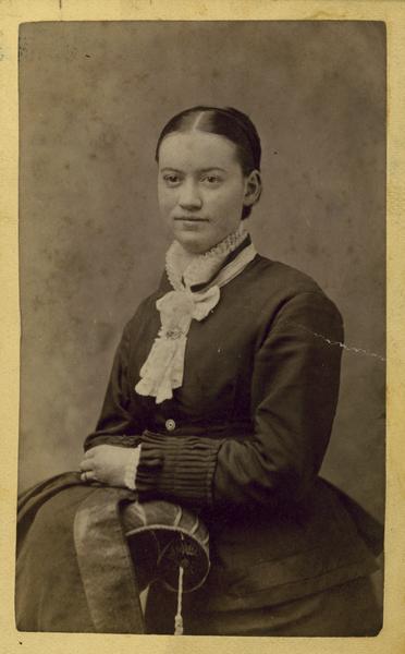 Gjertrud Amundsen Dahl, the wife of Andrew Dahl, in a studio portrait taken by her husband. The reverse of the photograph reads "A.L. Dahl, Landscape Photographer, DeForest, Wis." She married A.L. Dahl in 1878.