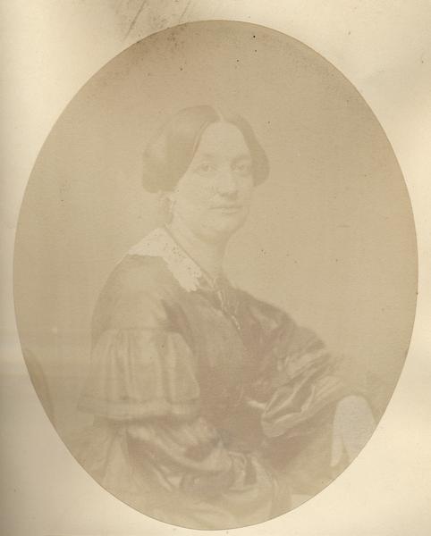 Waist-up oval portrait Adeline Irwin (Mrs. William S.) Strong was the daughter of Robert Irwin. Her first husband, David Blish, died in the 1847 fire on the <i>Phoenix</i>, a Great Lakes propeller ship. She was born in Green Bay on August 2, 1823. Her older sister, Mary, was born 18 July 1821, also in Green Bay, making her the first white woman born to Wisconsin settlers. The Strongs resided mainly in Kenosha. Adeline died 20 October 1874 and her husband died 1 November 1888.