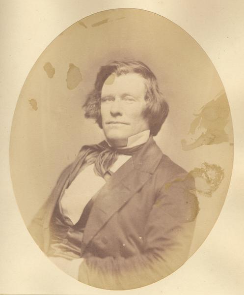 Waist-up oval portrait of Andrew Dunn.  He was born in Ireland and came to Wisconsin on June 26, 1833.  Dunn resided in Portage City where, in 1843, he was chairman of the county commissioners.