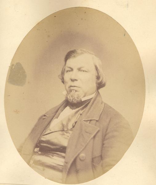 Waist-up oval portrait of John B. Du Bay.  He was born in Green Bay in 1810, and resided in Portage City.  In the 1830's, he established a trading post north of what is now Stevens Point along the Wisconsin River.