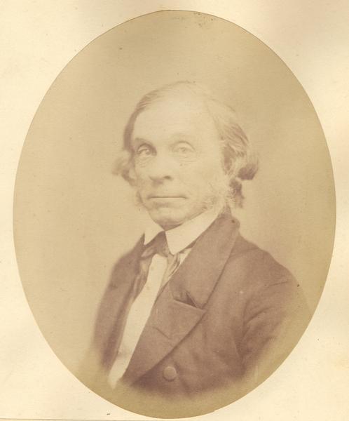 Quarter-length oval portrait of Henry Merrell. He was born in Utica, New York, and came to Wisconsin in May of 1834. Merrell settled at Fort Winnebago.
