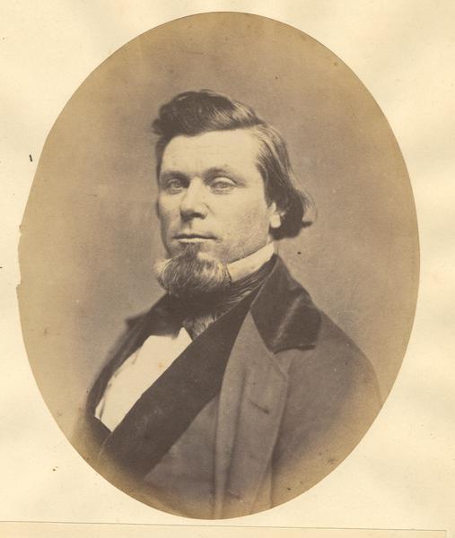 Quarter-length oval portrait of Hugh McFarland.  He was born in Plumbridge County, Tyrone, Ireland, on June 22, 1815.  McFarland emigrated to Wisconsin in September of 1834, and resided in Portage City.
