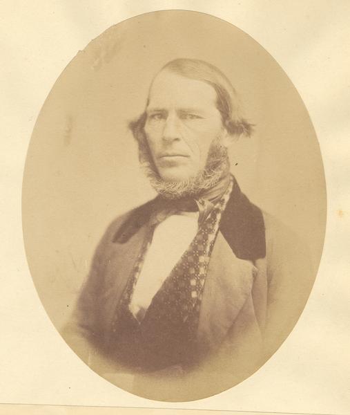 A quarter-length oval sepia-toned portrait of Walter B. Gage.  
