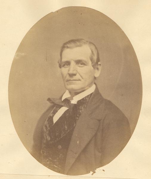 Quarter-length oval portrait of John Slothower.  He was born in Pennsylvania and came to Wisconsin in 1836.  He resided in Stevens Point, and was 45 years old at the time of the photograph.