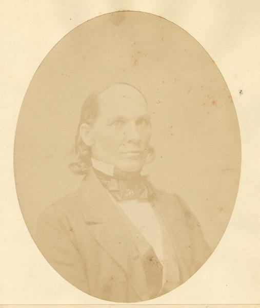 Quarter-length oval portrait of Pruecius Putnam. He was born in Andover, Windsor County, Vermont, on September 25, 1813. Putnam came to Wisconsin on November 1, 1836, and resided in Vernon where he assisted in building the town's first house.