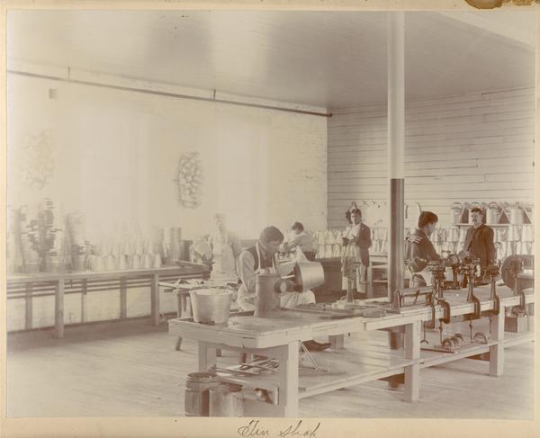 Students working in a tin shop at the Indian Industrial School.