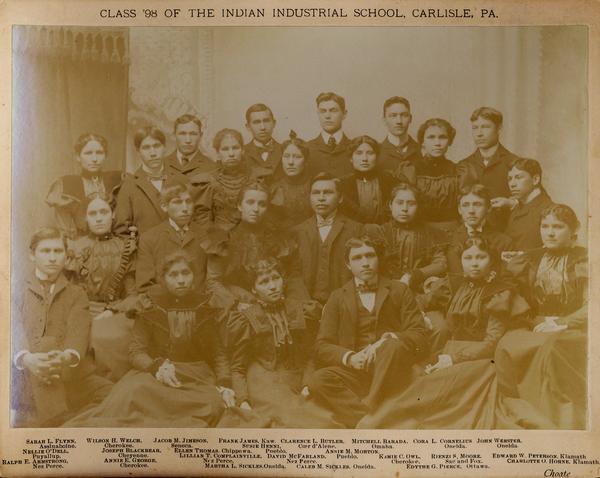 Indian Industrial School class, posed for a portrait.