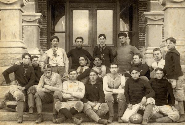 Group portrait of the 1898 Henry Kendall College football team, made up of four Creek Indians, two Choctaw Indians, one Cherokee Indian, and ten white men.