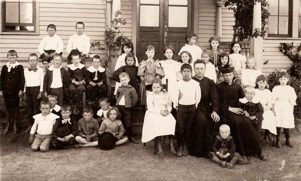 Students and priests at Sisters of St. Joseph School.