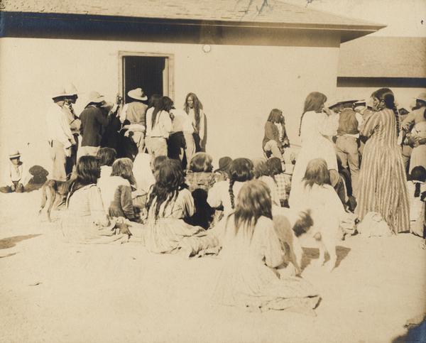 A group of Indian children and adults, possibly at the Pima Agency.