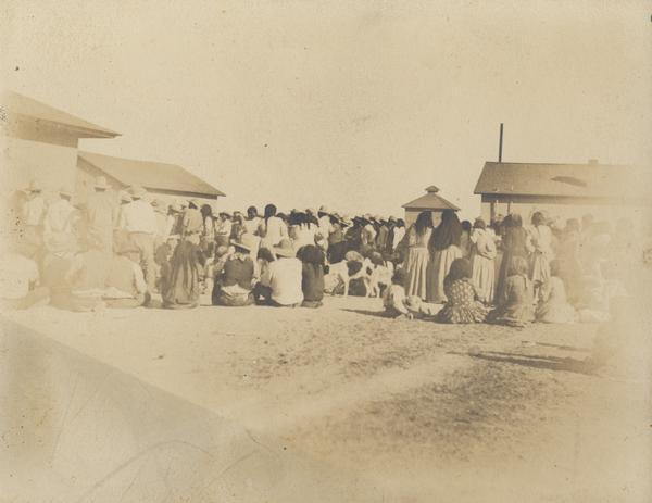 A large group of Indians gather, possibly at the Pima Agency, near Phoenix.