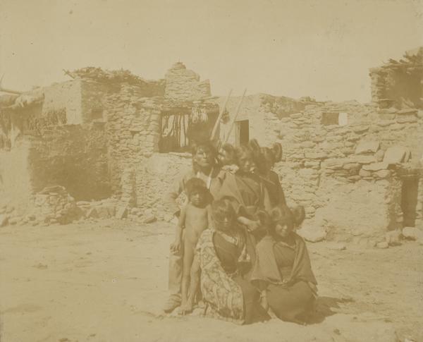 A Moqui [Hopi] Indian group of adults and children.