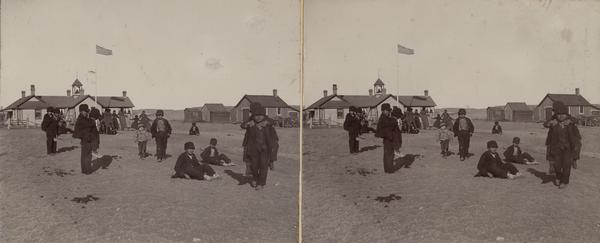 Children outdoors for recess at the Lower Cut Meat Creek School, part of the Rosebud Agency.