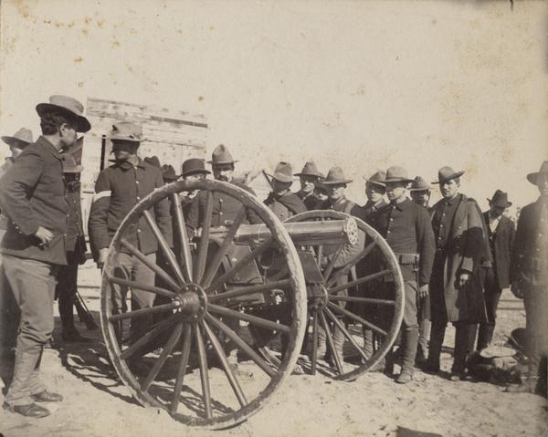 A cavalry troop gathers around a cannon at the Ojibwa-Pillager Battle at Sugar Point on Bear Island.