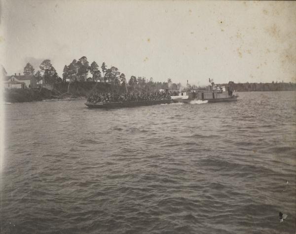 Cavalry on a barge are going from or returning to Bear Island at the Ojibwa-Pillager Battle at Sugar Point on Bear Island.