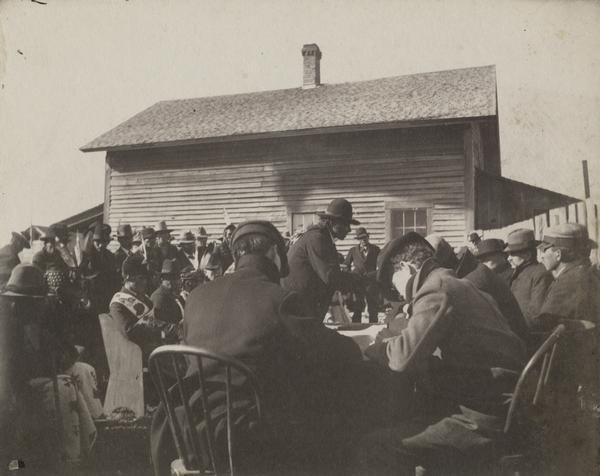 Men gather at the Council at the Leech Lake Agency.  W.A. Jones is seated second from the right.  This image is part of a collection of images of the Ojibwa-Pillager Battle at Sugar Point on Bear Island.