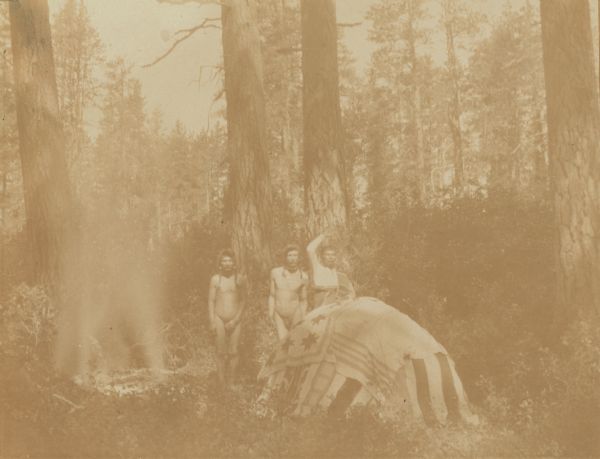 An Indian sweat house in operation, with stones heated at the left, at the Warm Springs Agency in Oregon.