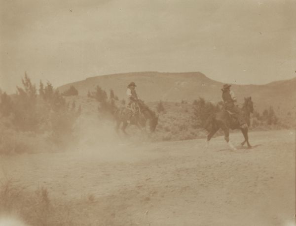 Men or cowboys on horseback at the Indian Warm Springs Agency.